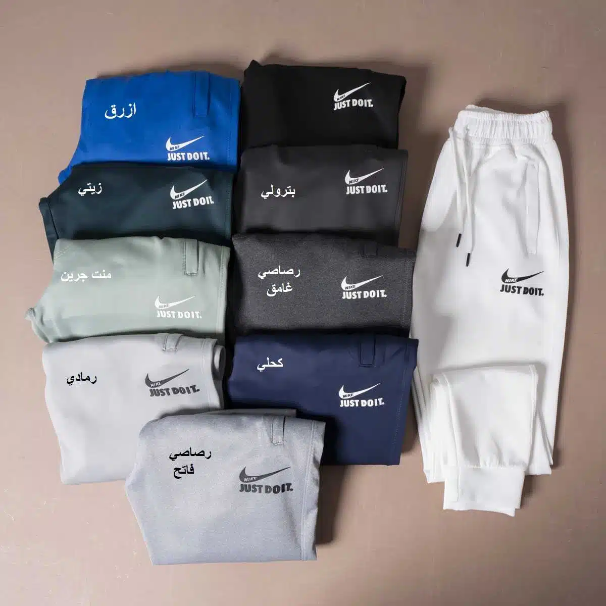 بنطلون NIKE  مستورد لوجو رابر بارز  ألوان