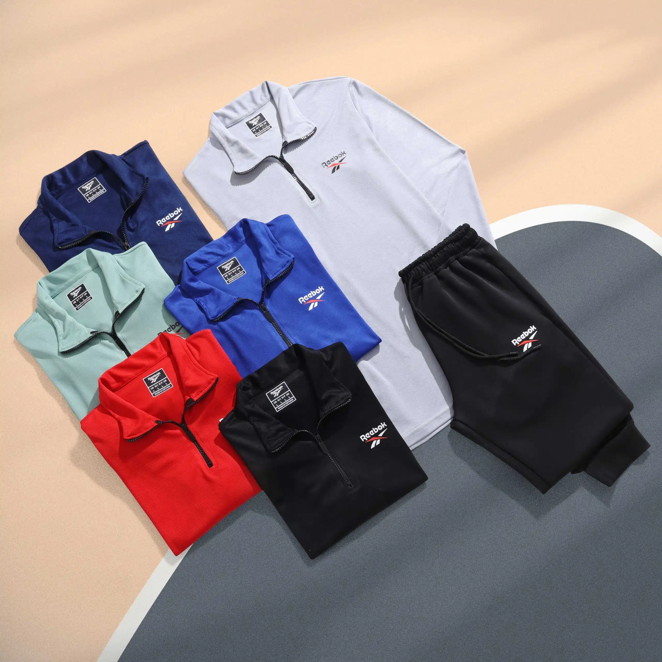 طقم رياضي تيشرت كم + بنطلون Reebok